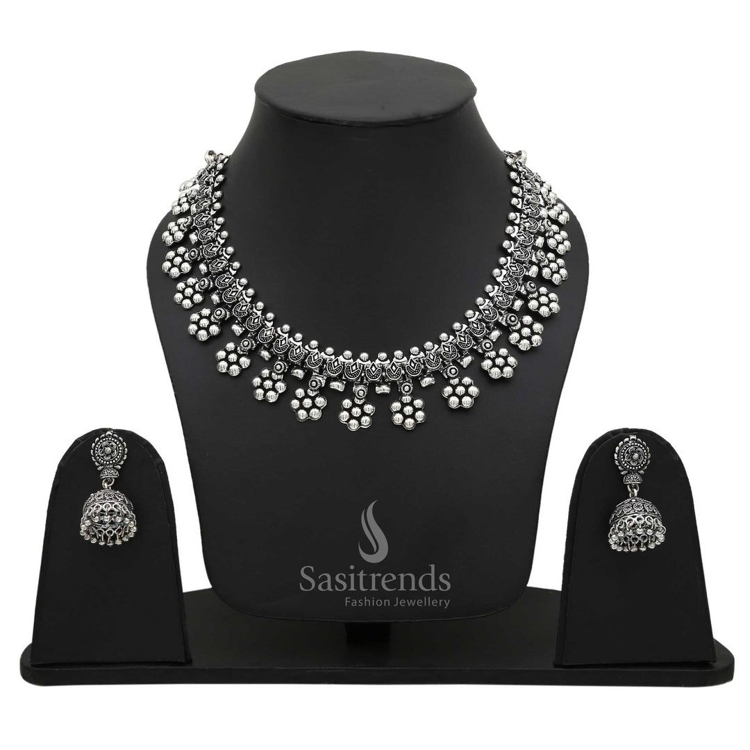 Vintage Oxidised Silver Floral Motif Necklace with Dangling Jhumka Earrings—an artistic handcrafted jewellery set that blends beautifully with cultural and fusion attire – Sasitrends