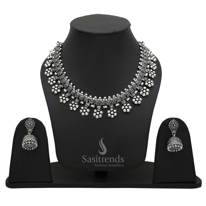 Vintage Oxidised Silver Floral Motif Necklace with Dangling Jhumka Earrings—an artistic handcrafted jewellery set that blends beautifully with cultural and fusion attire – Sasitrends