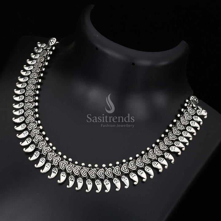 Sacred threads of heritage – this Kolhapuri oxidised fusion necklace features an antique symbolic pendant and classic folk jewellery construction – Sasitrends