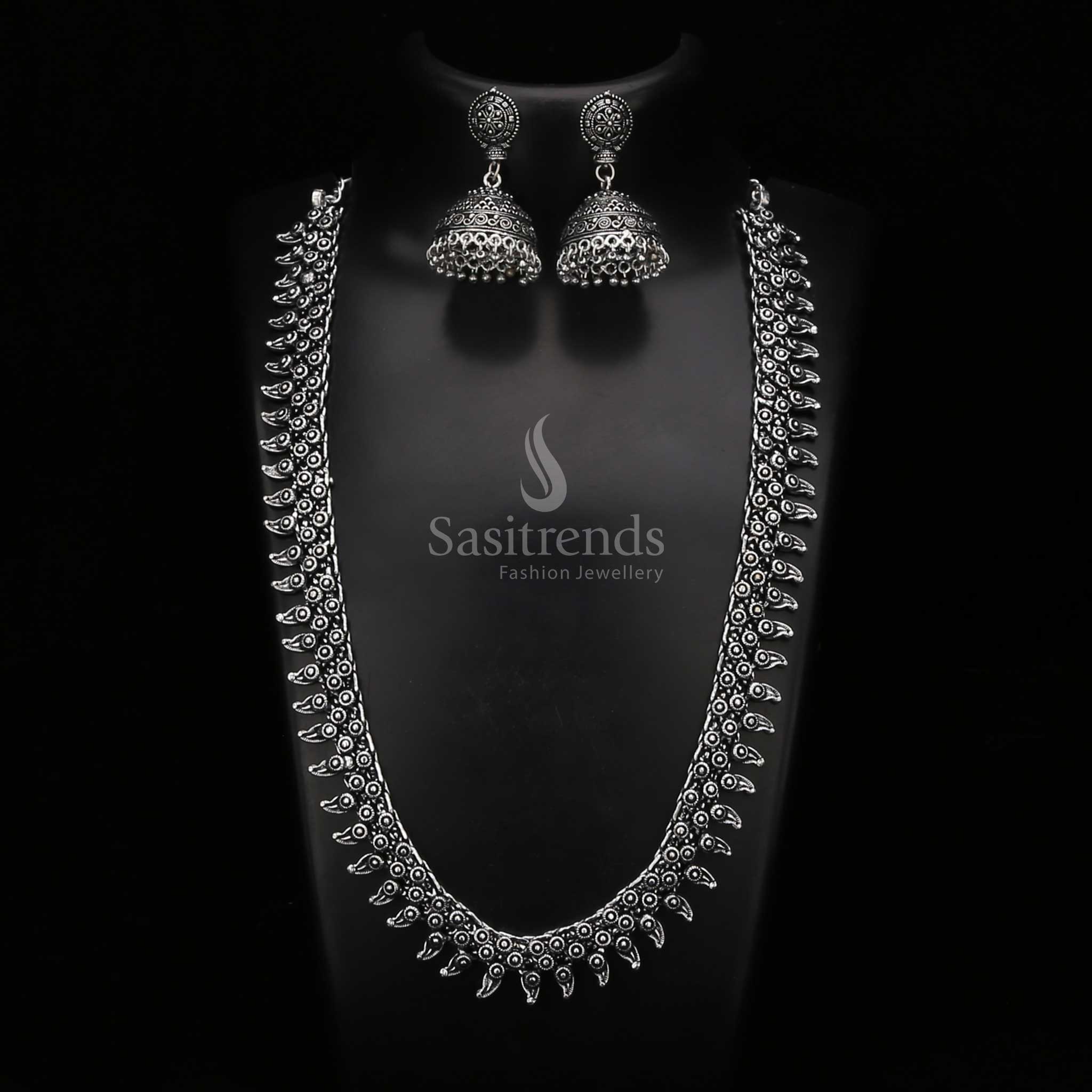 Artistic oxidised silver haram jewellery set with an intricately carved pendant and filigree-style jhumkas – a striking choice for cultural fashion lovers – Sasitrends

