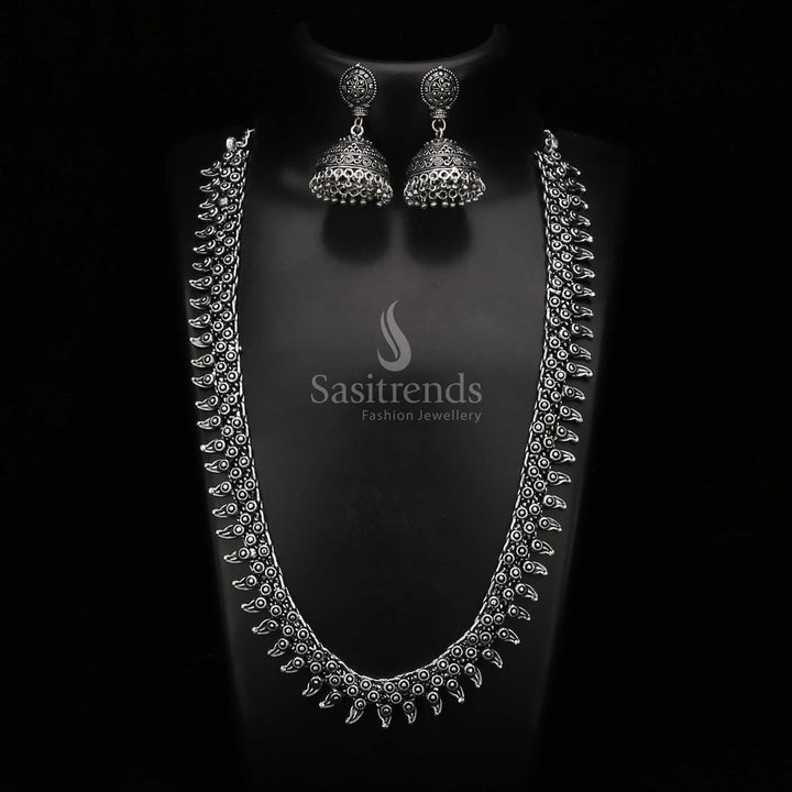 Artistic oxidised silver haram jewellery set with an intricately carved pendant and filigree-style jhumkas – a striking choice for cultural fashion lovers – Sasitrends

