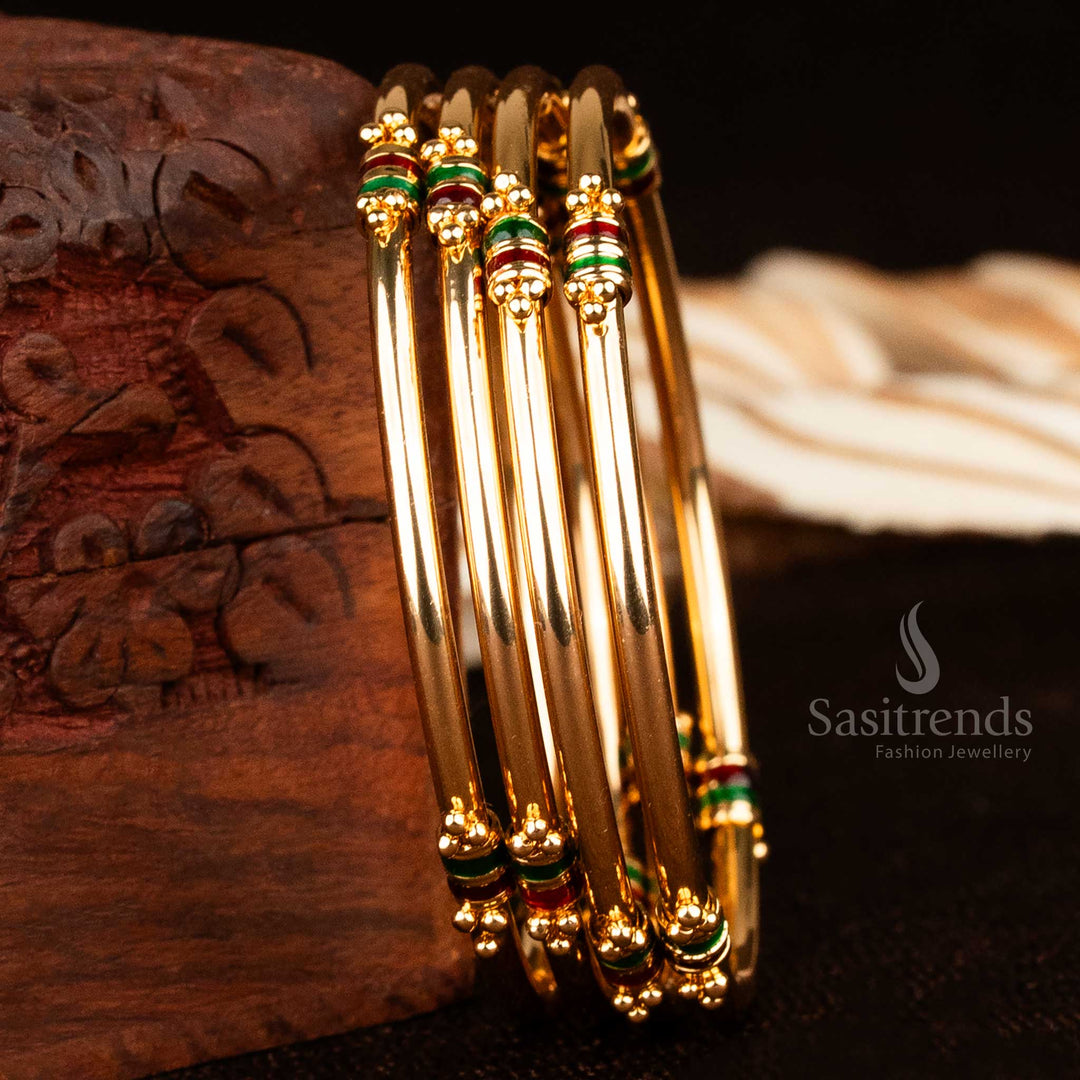 Elegant sleek thick micro gold plated bangles duo with golden enamel and subtle red-green hues in a traditional heritage style, crafted for dainty wrist styling and light festive charm – sasitrends