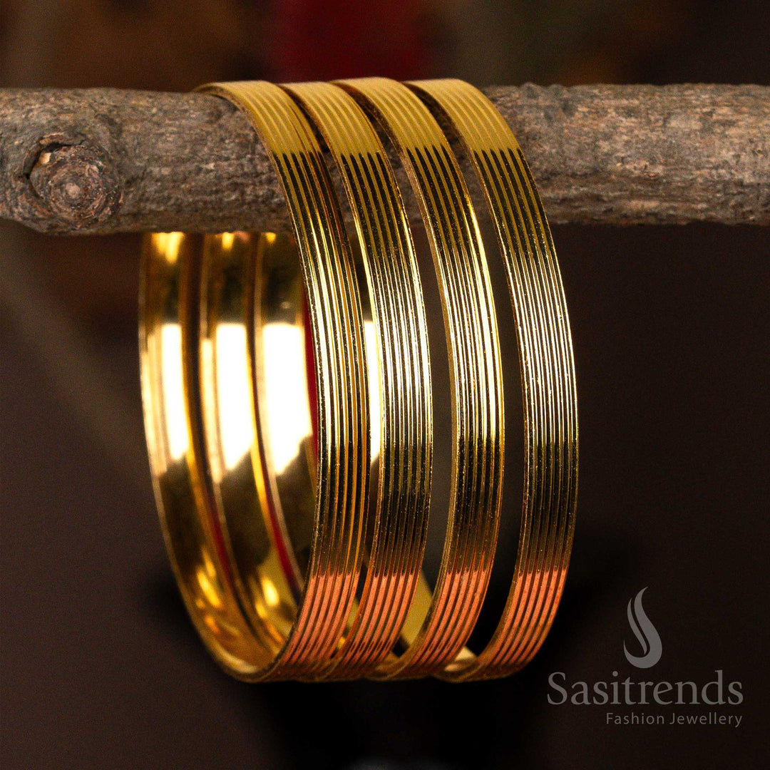 Set of four sleek micro gold-plated kada bangles with a luminous finish for everyday elegance.