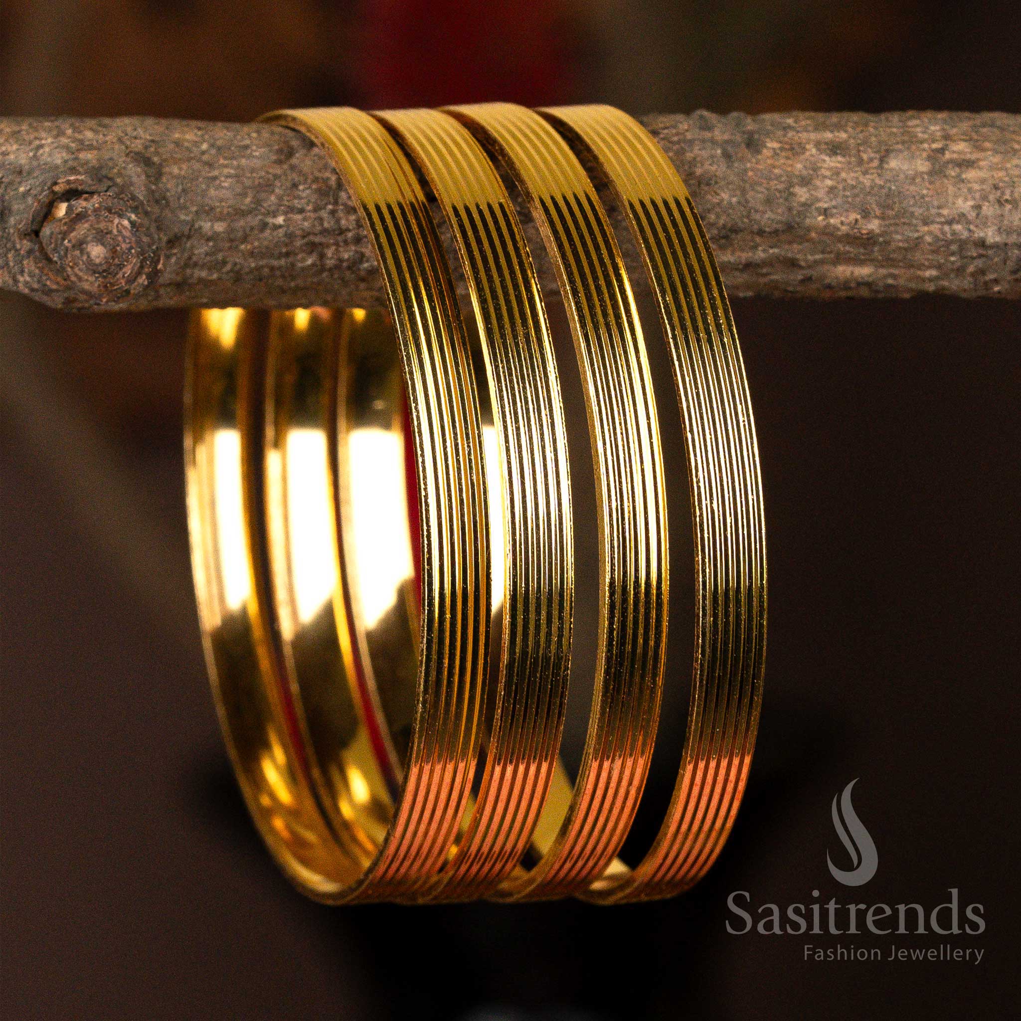 Set of four sleek micro gold-plated kada bangles with a luminous finish for everyday elegance.