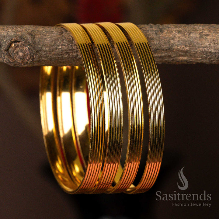 Set of four sleek micro gold-plated kada bangles with a luminous finish for everyday elegance.