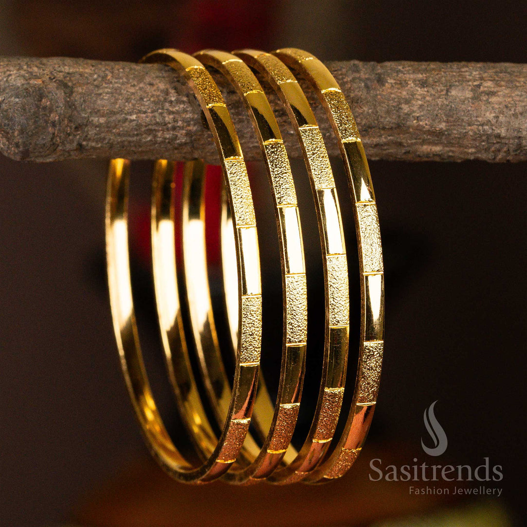 A 4-piece set of micro gold-plated bangles with a unique textured finish
