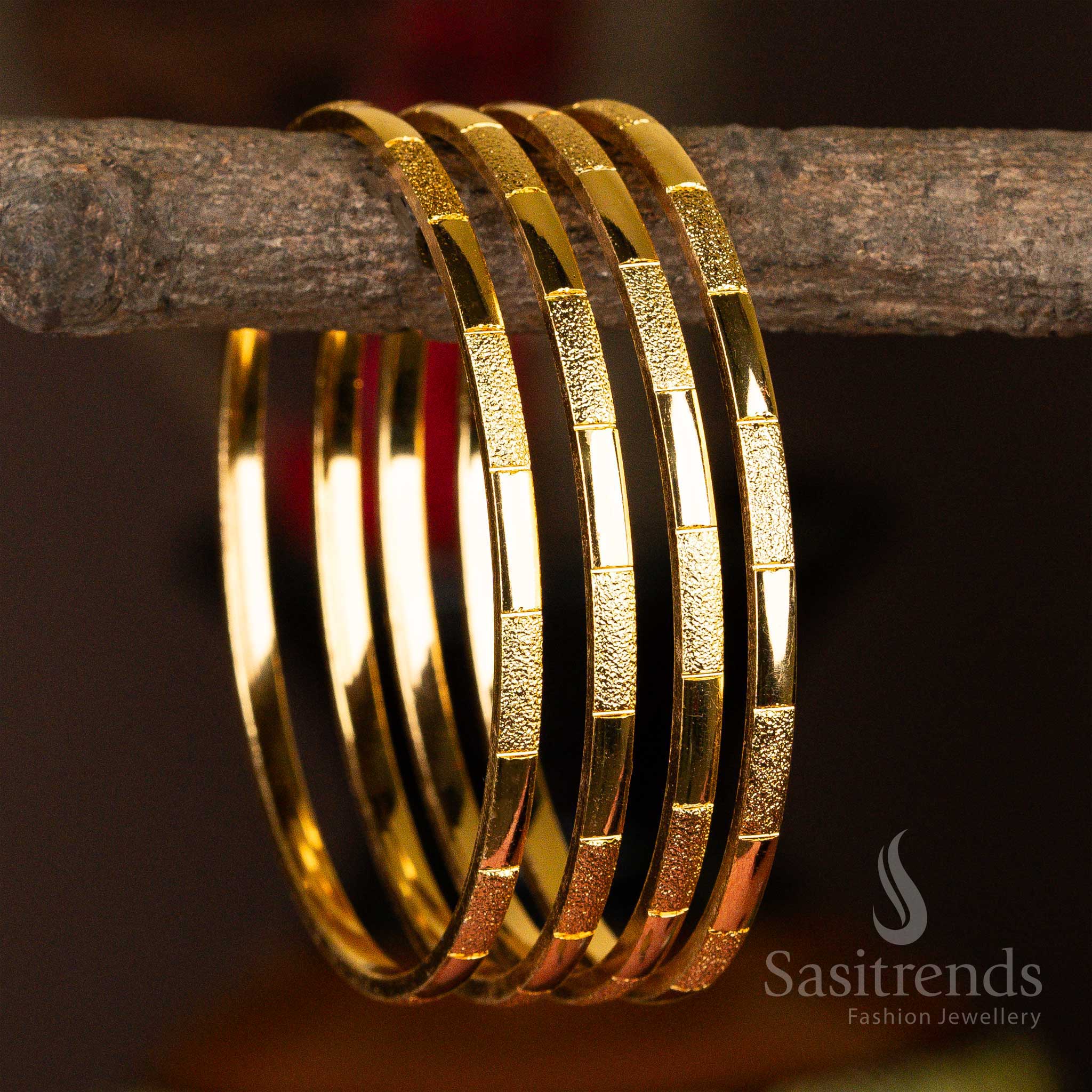 A 4-piece set of micro gold-plated bangles with a unique textured finish