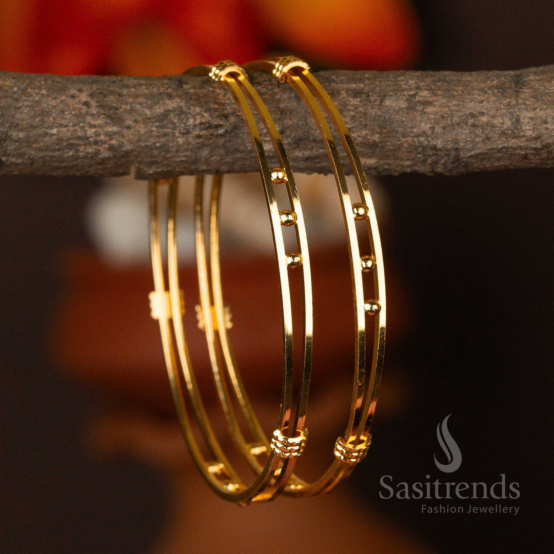 Polished micro gold-plated bangles adorned with evenly spaced golden orbs