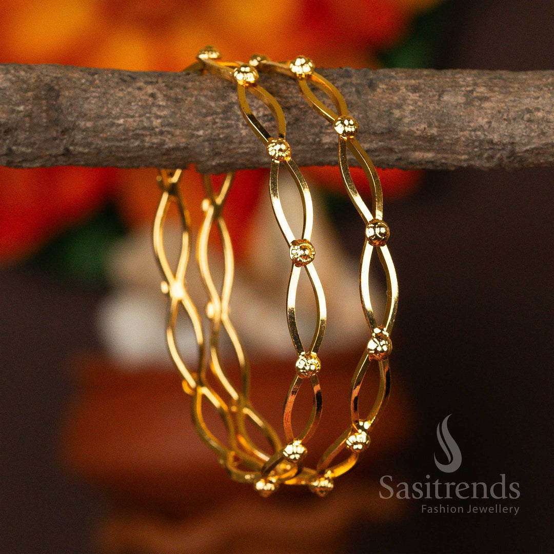 Delicate micro gold-plated bangles featuring an infinity loop design with golden beads