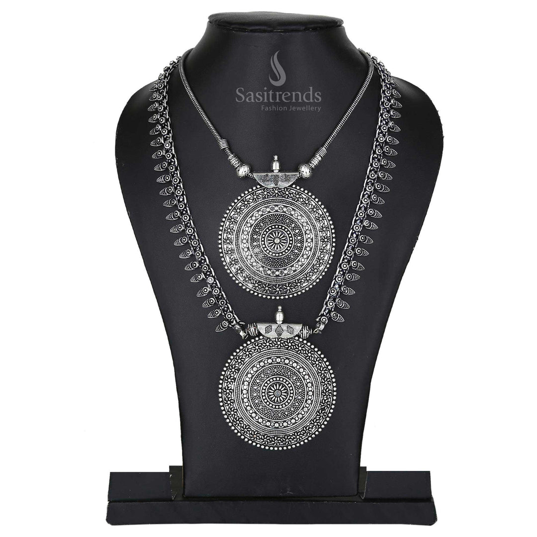 Niranjana oxidised antique silver long haram and pendant chain set featuring artistic motifs and festival-ready earrings – a captivating jewellery set for ethnic celebrations – Sasitrends

