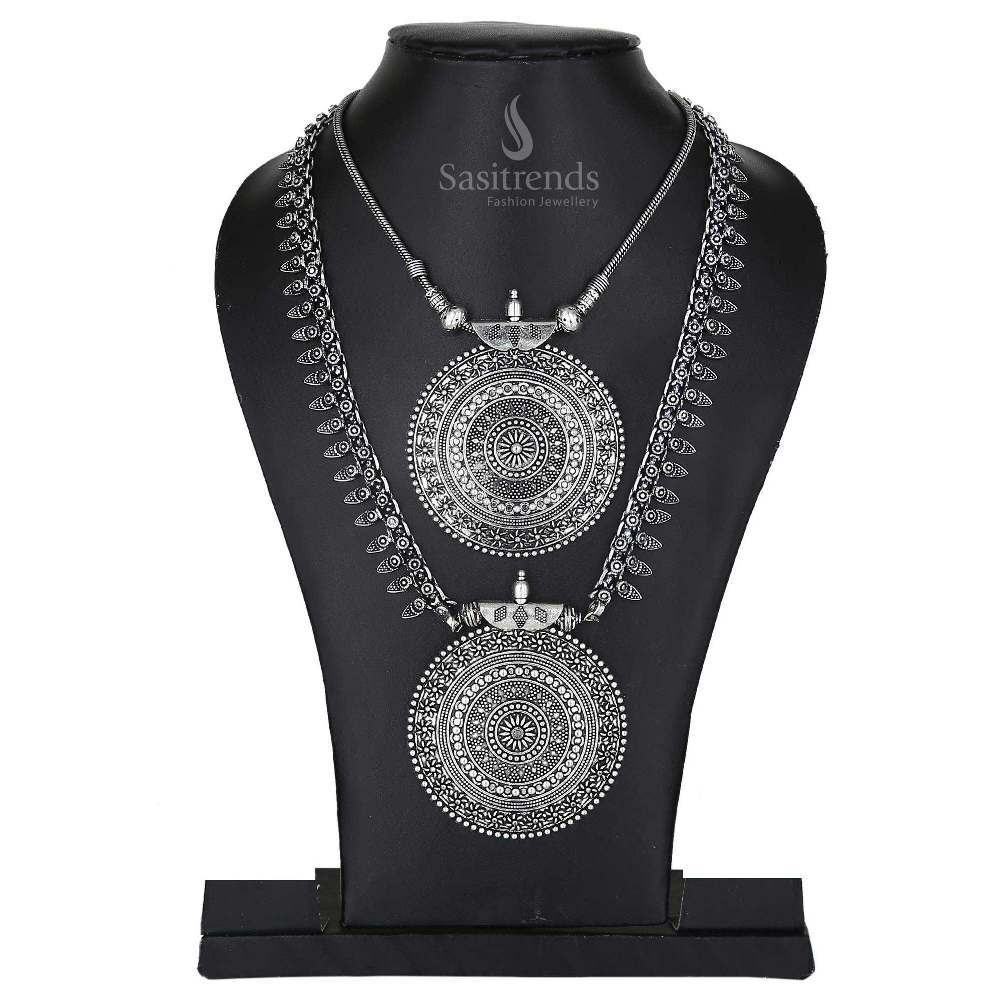 Niranjana oxidised antique silver long haram and pendant chain set featuring artistic motifs and festival-ready earrings – a captivating jewellery set for ethnic celebrations – Sasitrends

