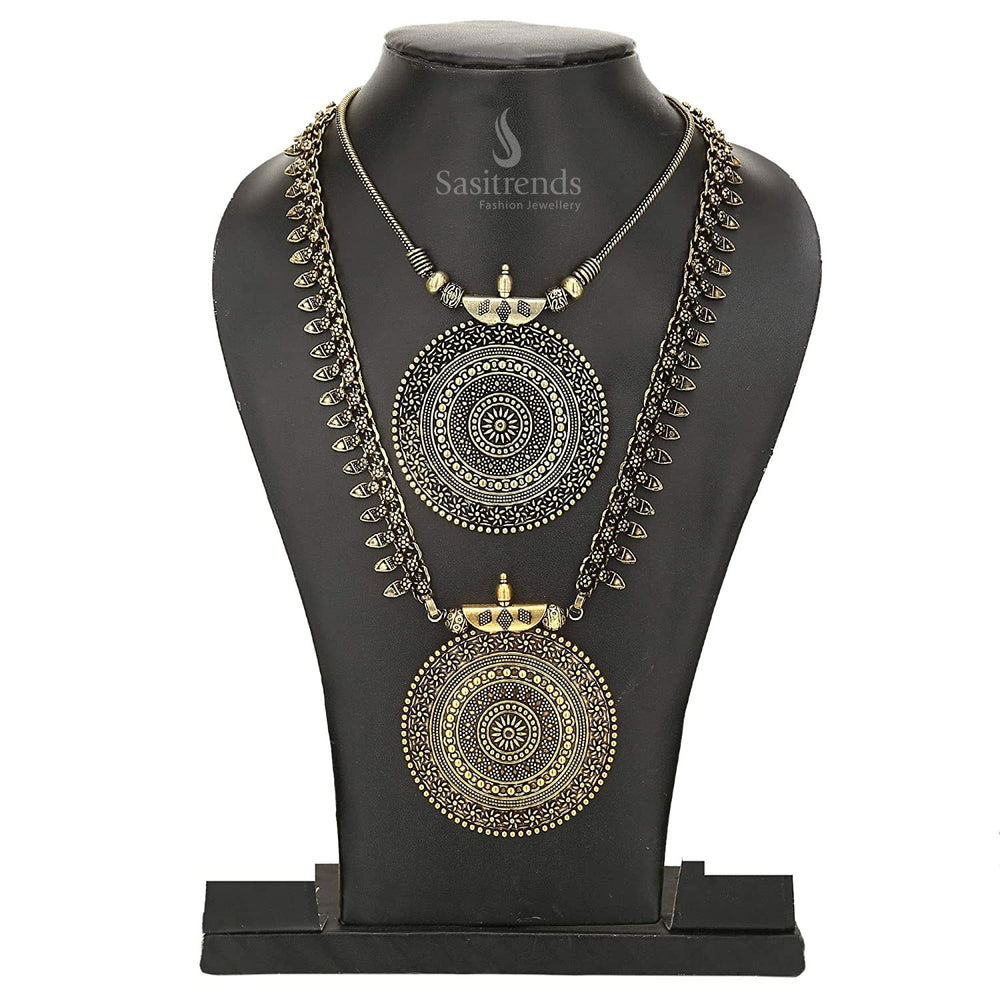 Niranjana antique silver oxidised long haram with intricately engraved floral pendant, matching jhumka earrings and elegant chain – traditional temple-style jewellery set for saree and ethnic wear – Sasitrends