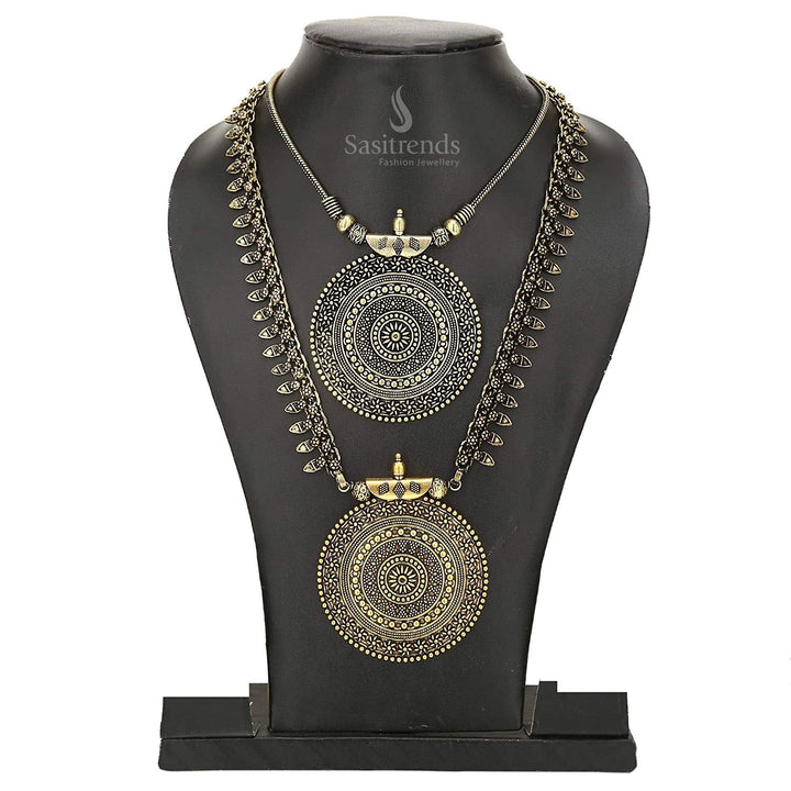 Niranjana antique silver oxidised long haram with intricately engraved floral pendant, matching jhumka earrings and elegant chain – traditional temple-style jewellery set for saree and ethnic wear – Sasitrends