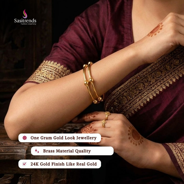 Beautiful collection of micro gold plated bangles styled by a model, elegant traditional jewellery suitable for festive wear, wedding functions, party occasions, and ethnic outfits from Sasitrends.