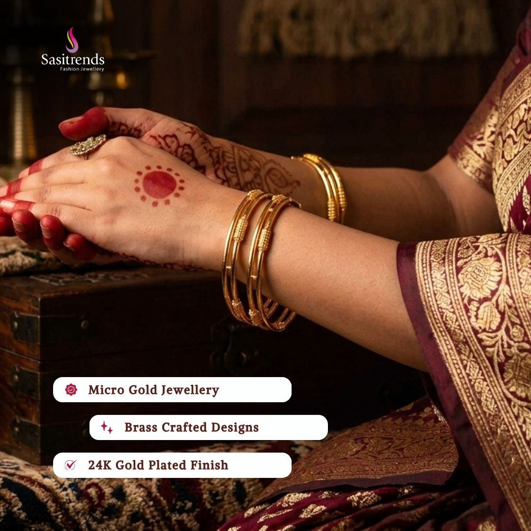 Beautiful collection of micro gold plated bangles styled by a model, elegant traditional jewellery suitable for festive wear, wedding functions, party occasions, and ethnic outfits from Sasitrends.