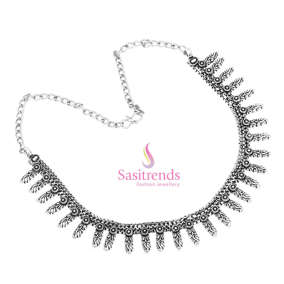 Celestial dusk-inspired oxidised silver necklace features an embossed peacock centre and paisley drops – a bold tribal statement for festive jewellery styling – Sasitrends