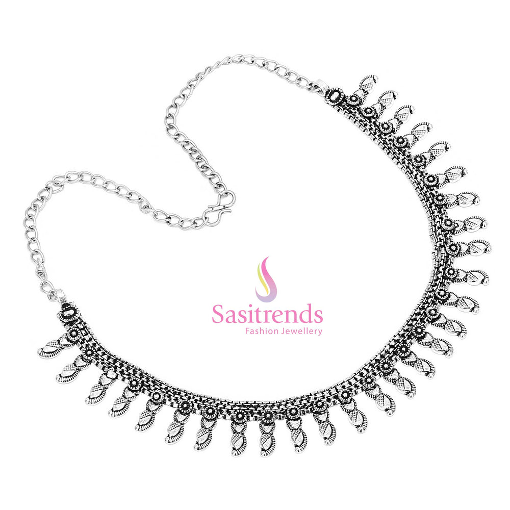 Echoes of Kutch tradition vibrantly come alive in this oxidised silver pendant necklace, finished with coin motifs and antique tribal textures – Sasitrends