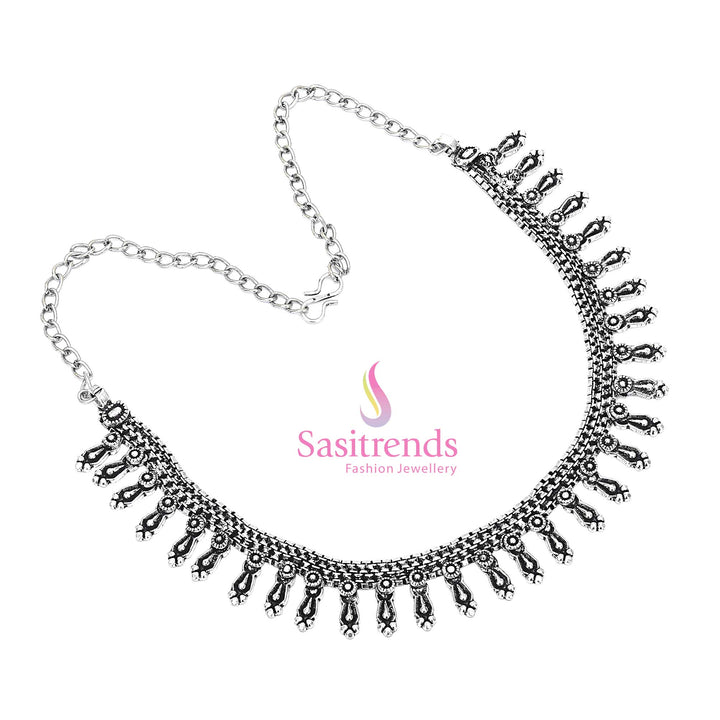 Sacred tales carved in metal – this oxidised German silver collar necklace holds warrior symbols and bead fringes, ideal for tribal occasion jewellery – Sasitrends