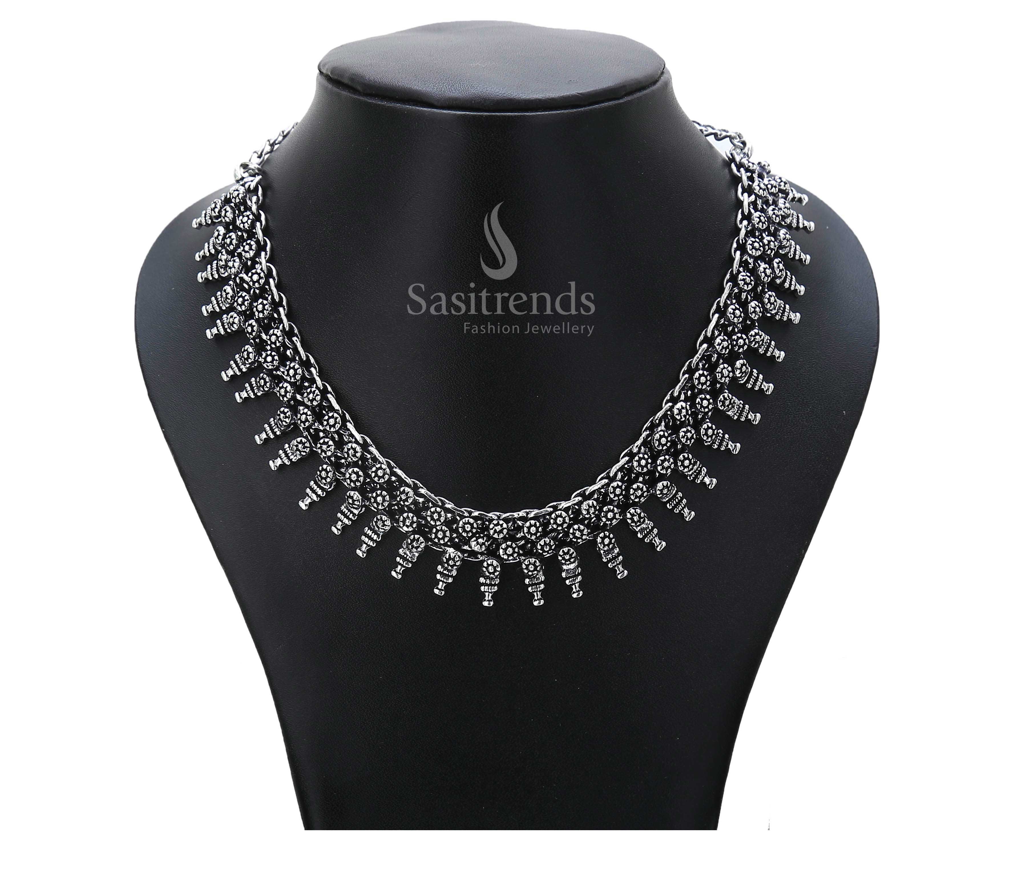 Vintage saga told through oxidised silver elegance – this ethnic ancestral necklace bears a mythical motif and dome-shaped drops for regal folkwear – Sasitrends