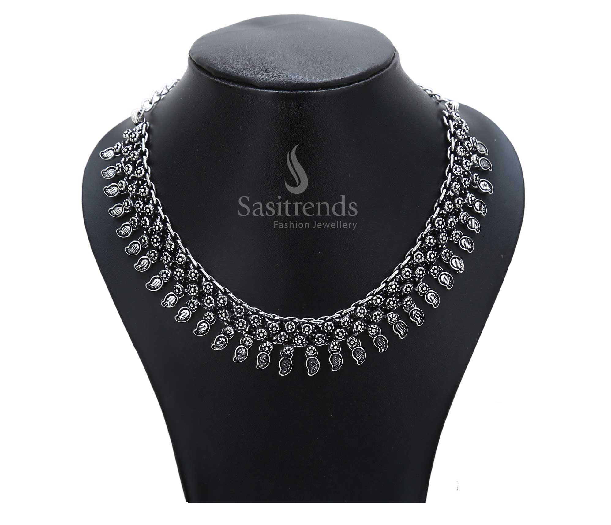 Timeless soil of tradition reflected in this oxidised ancestral necklace with tribal symbolic art and a hammered central pendant – ethnic jewellery from the soul – Sasitrends