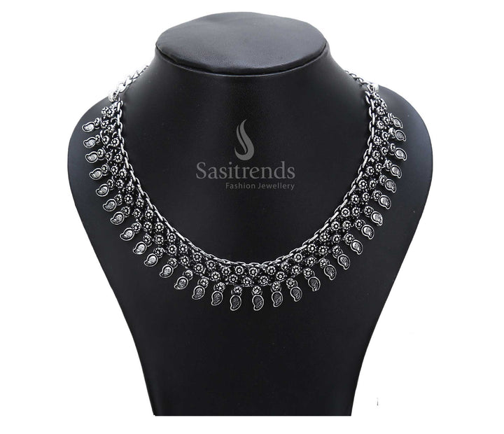 Timeless soil of tradition reflected in this oxidised ancestral necklace with tribal symbolic art and a hammered central pendant – ethnic jewellery from the soul – Sasitrends