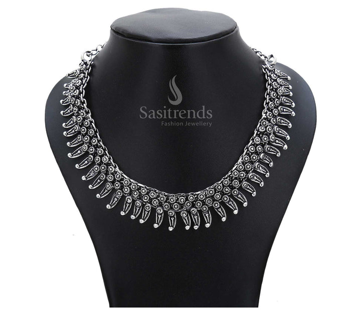 Ancestor melody plays on in this oxidised chain necklace with rustic drum-shaped pendants and ethnic circular motifs – inspired tribal jewellery – Sasitrends