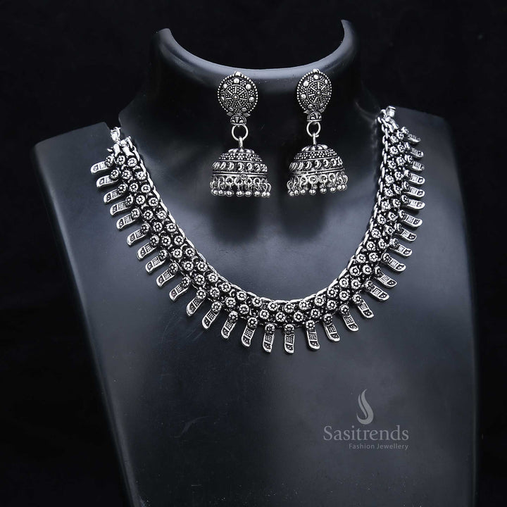 Rustic tradition radiates from this oxidised silver jewellery set featuring a hand-etched necklace and tribal design jhumkas – made for authentic cultural wear – Sasitrends