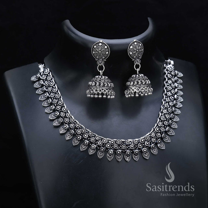 Floral glory shines through this oxidised silver jewellery set with carved necklace and classic jhumka drops – inspired by ancestral beauty – Sasitrends