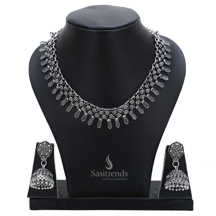 Antique essence defines this oxidised silver necklace set with round jhumka earrings and ethnic accents – perfect for traditional jewellery lovers – Sasitrends