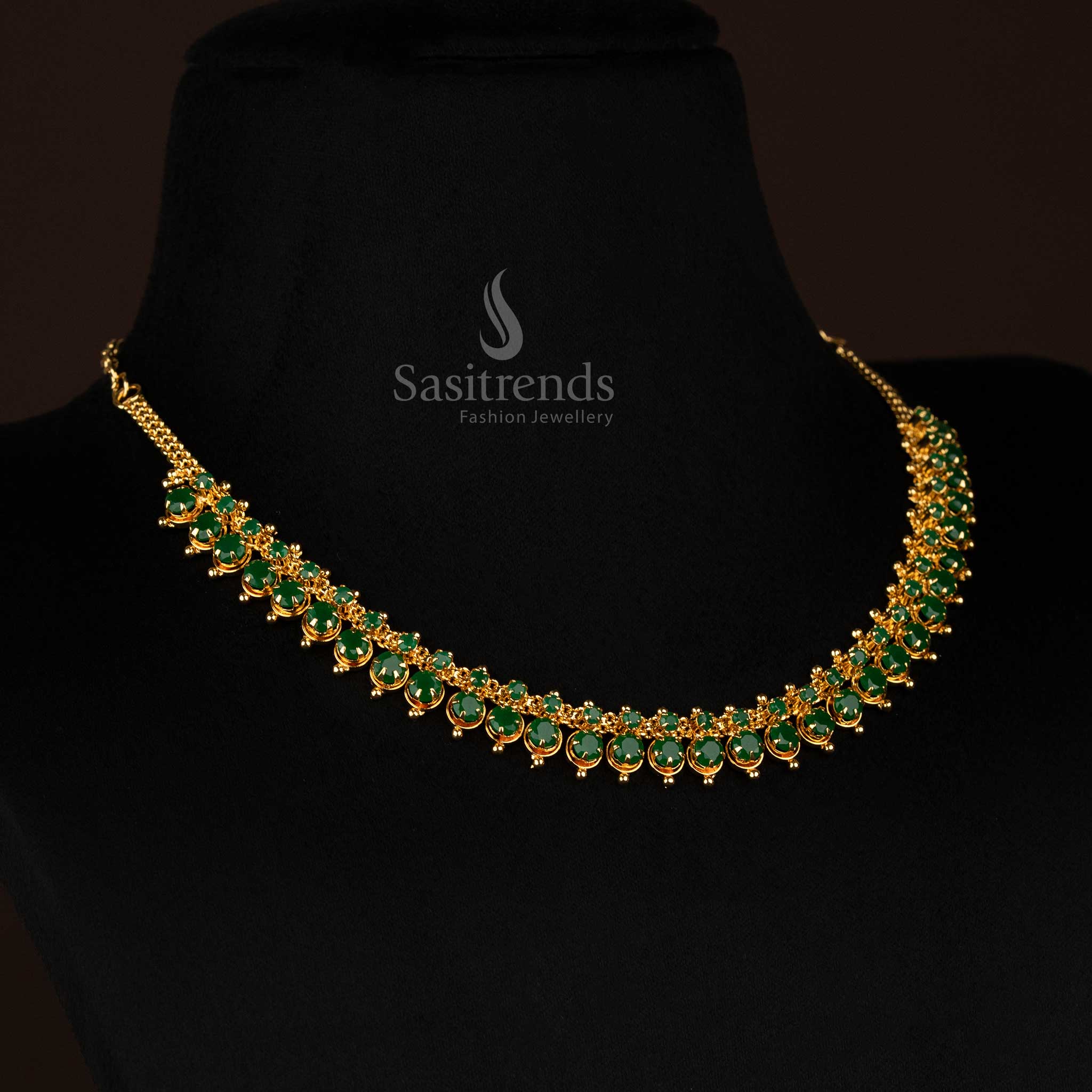 Royal-finish micro gold plated necklace with fixed Green Color AD stones in a unique fusion design, offering a statement ethnic jewellery style for special occasions – curated by Sasitrends