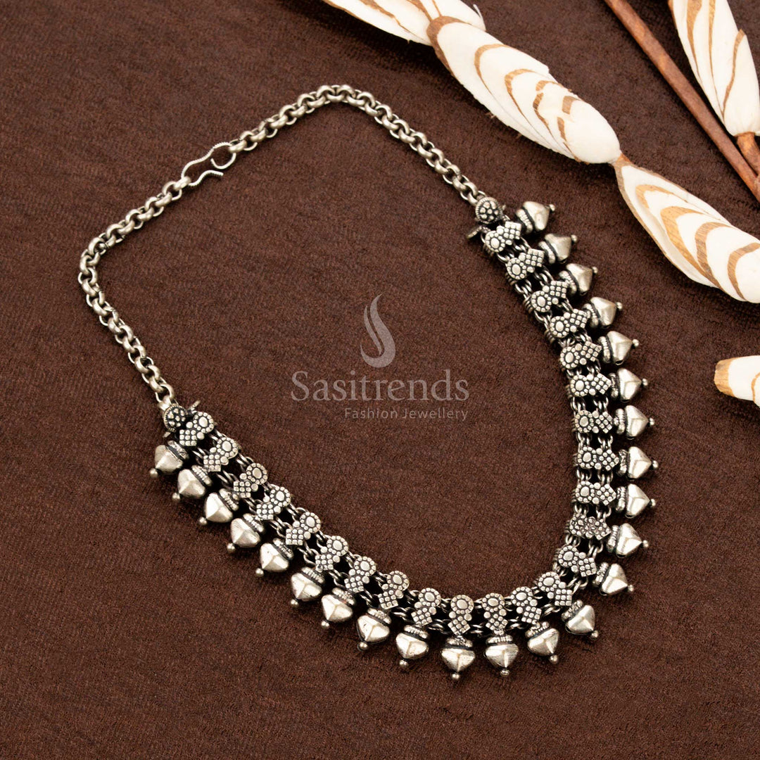 Traditional tribal oxidised necklace with floral and cone designs – Sasitrends