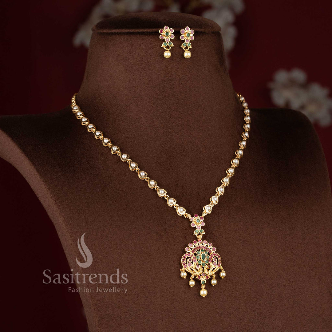 Sasitrends micro gold plated peacock floral pendant necklace jewellery set featuring pearl drops with ruby and green AD stone detailing crafted for traditional and cultural styling