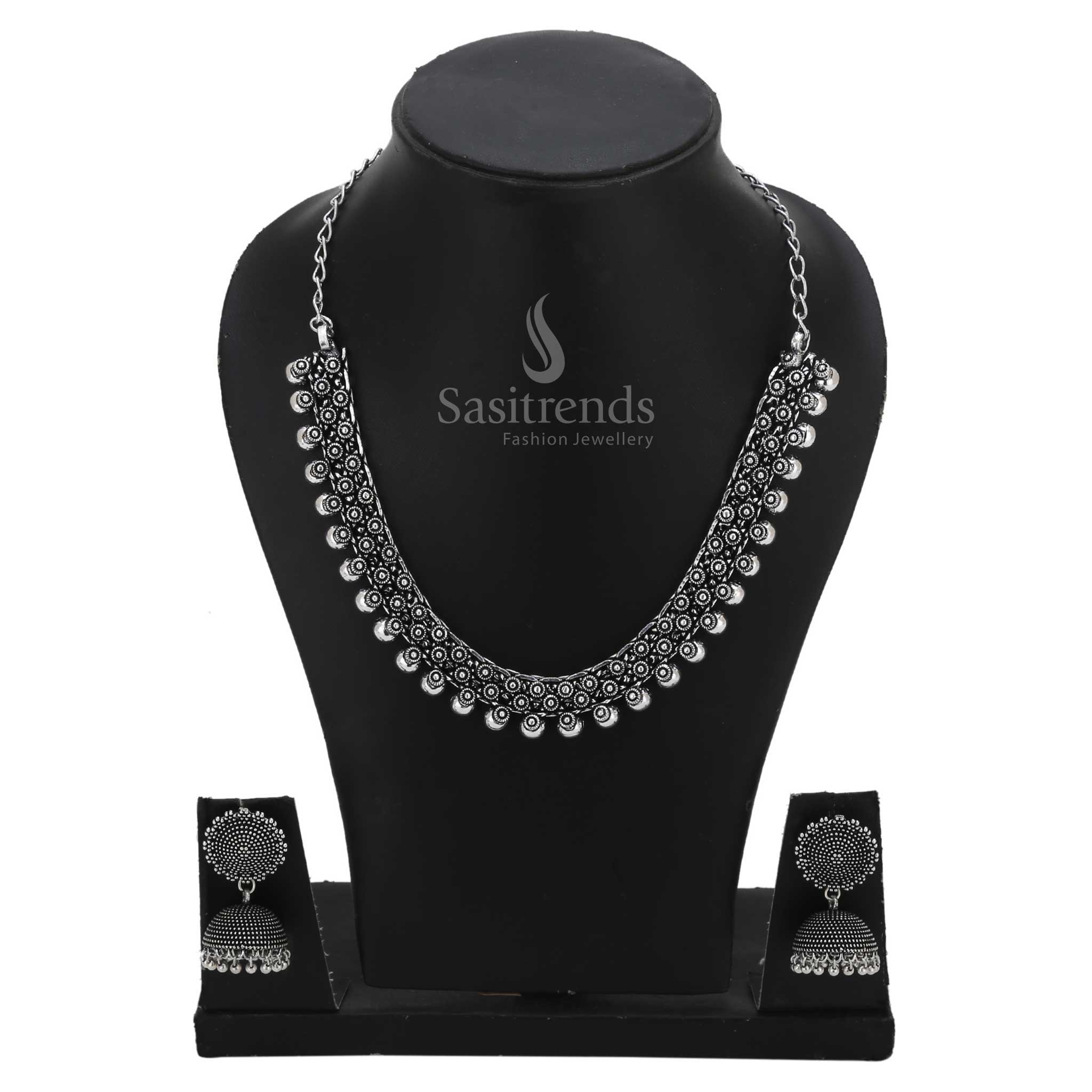 Treasures Chintaka oxidised silver necklace set adorned with traditional bead cluster accents and classic jhumkas for timeless festive fashion – Sasitrends
