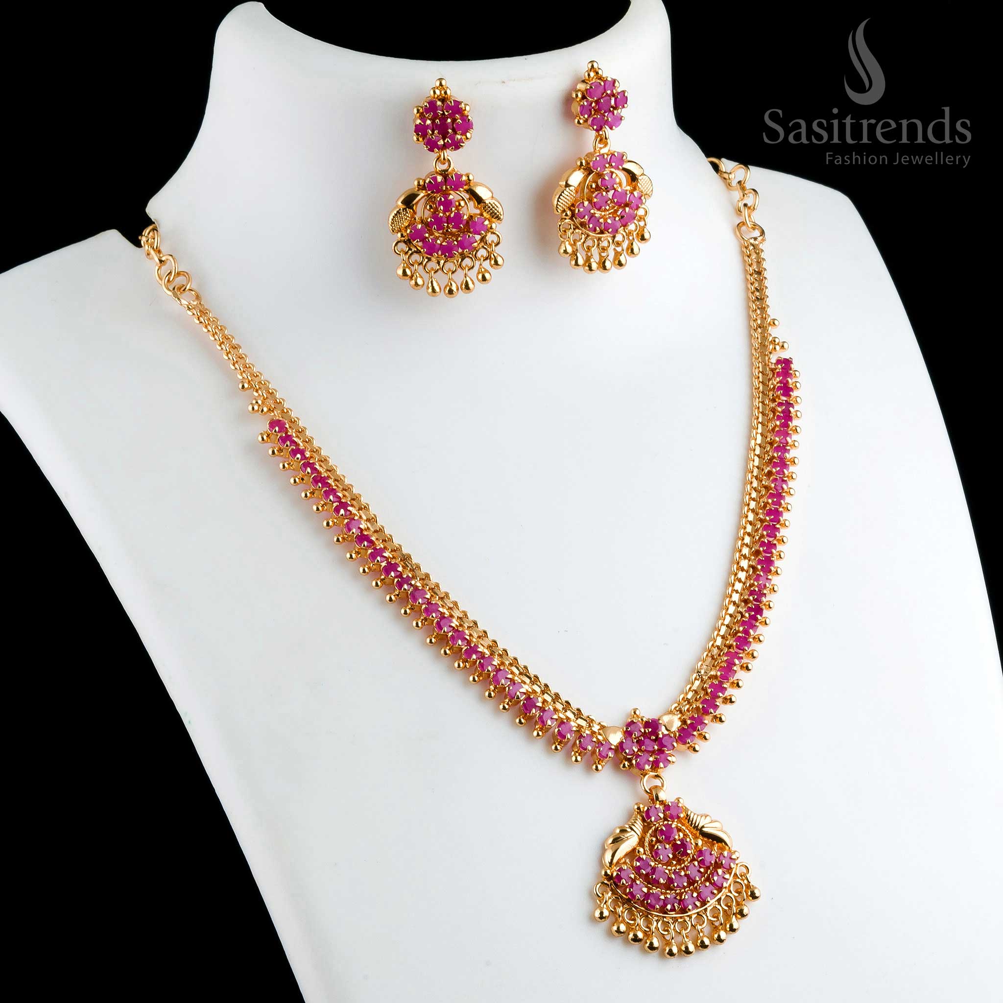 Beautiful ornate micro gold plated ruby floral pendant necklace with matching earrings, designed with golden balls for a traditional look - Sasitrends