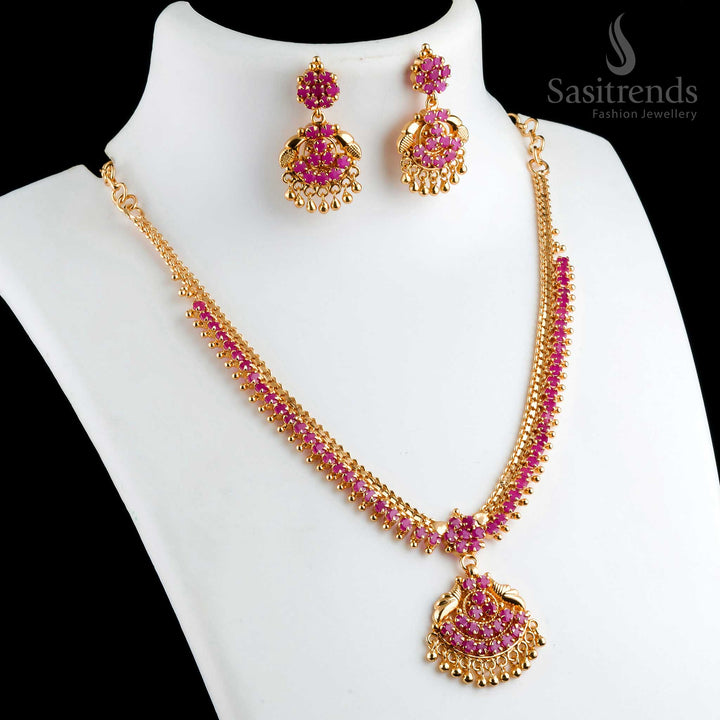 Beautiful ornate micro gold plated ruby floral pendant necklace with matching earrings, designed with golden balls for a traditional look - Sasitrends
