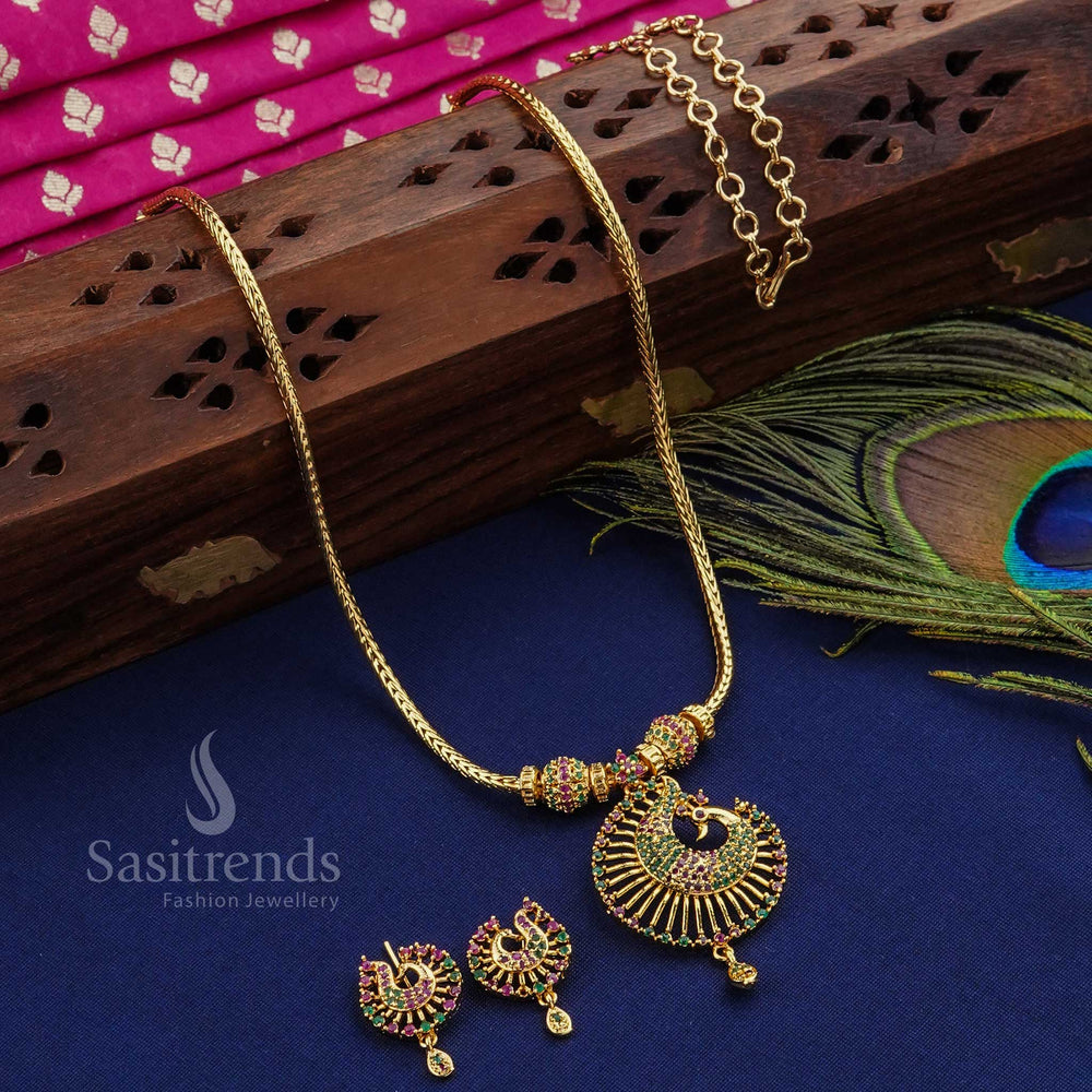 Stunning and regal ruby-green peacock design pendant ball jewellery set, micro gold plated and studded with shimmering American diamonds - Sasitrends