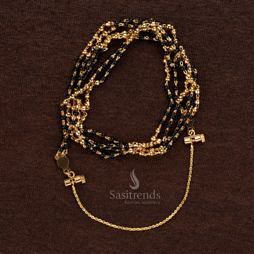 Stunning double-layered Thali Saradu chain featuring intricate black beads and golden accents, ideal for ethnic ceremonies and special events - Sasitrends