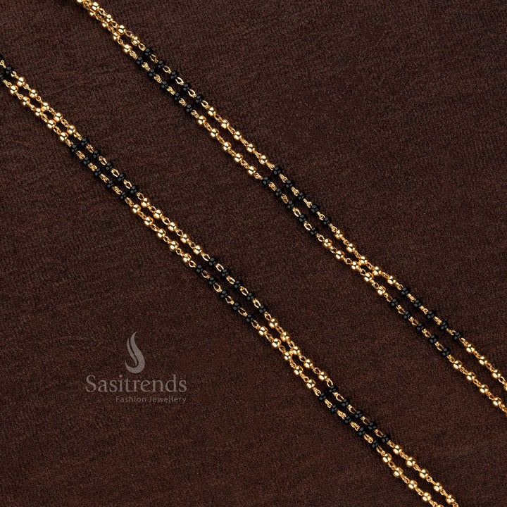 Exquisite double-layered black beaded Thali Saradu chain adorned with shimmering gold beads, crafted for timeless traditional elegance - Sasitrends