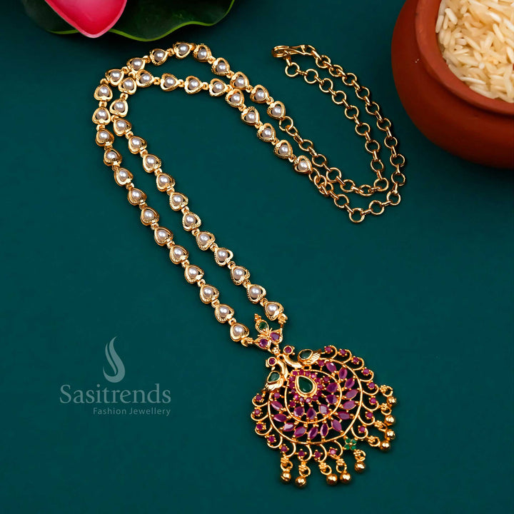 Traditional temple jewellery featuring ruby-green stonework, a graceful peacock pendant, and classic pearl detailing – micro gold plated with festive elegance – Sasitrends