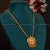 Traditional Pendant Dollar Necklace with ruby-green stones encircling a Lakshmi motif