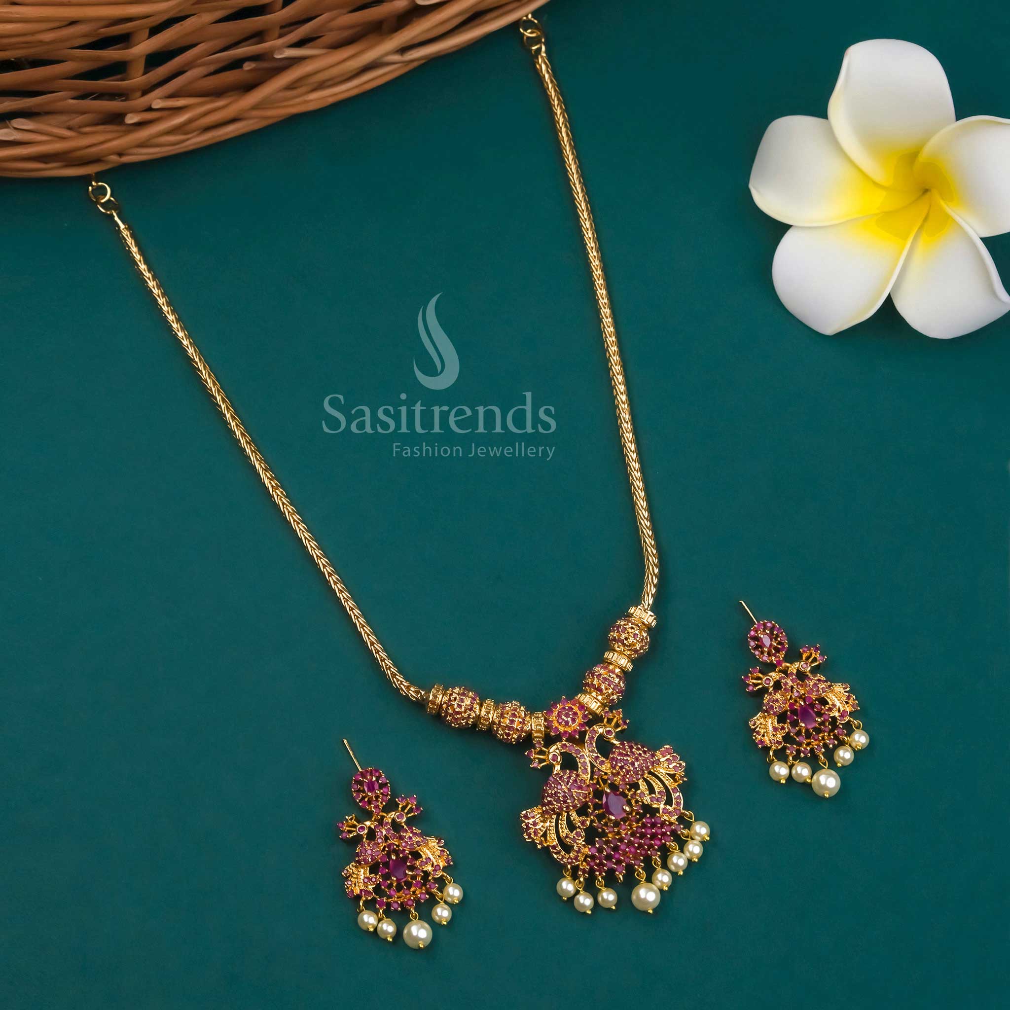 Micro Gold Plated Peacock Pendant Necklace Set with Earrings adorned with American Diamond Stones in Ruby hues - Perfect for Traditional Occasions - Sasitrends