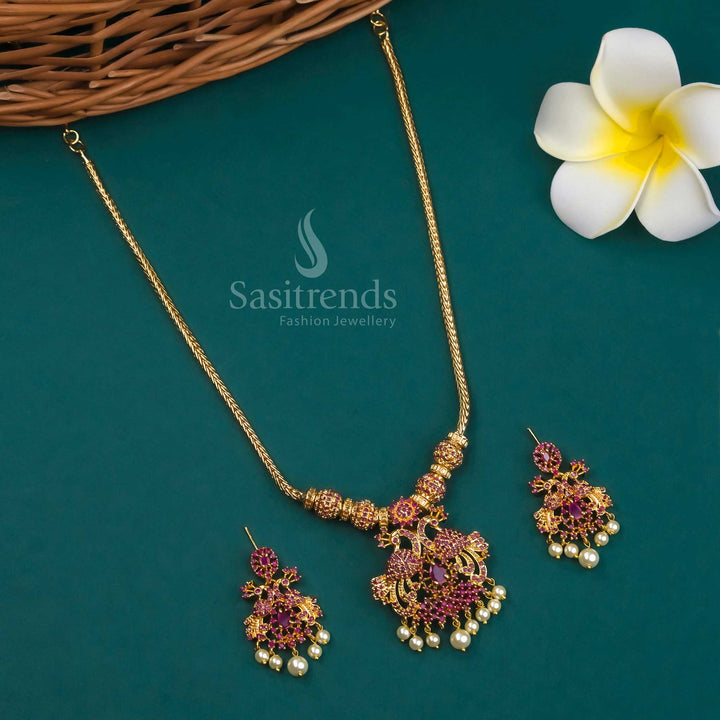 Micro Gold Plated Peacock Pendant Necklace Set with Earrings adorned with American Diamond Stones in Ruby hues - Perfect for Traditional Occasions - Sasitrends