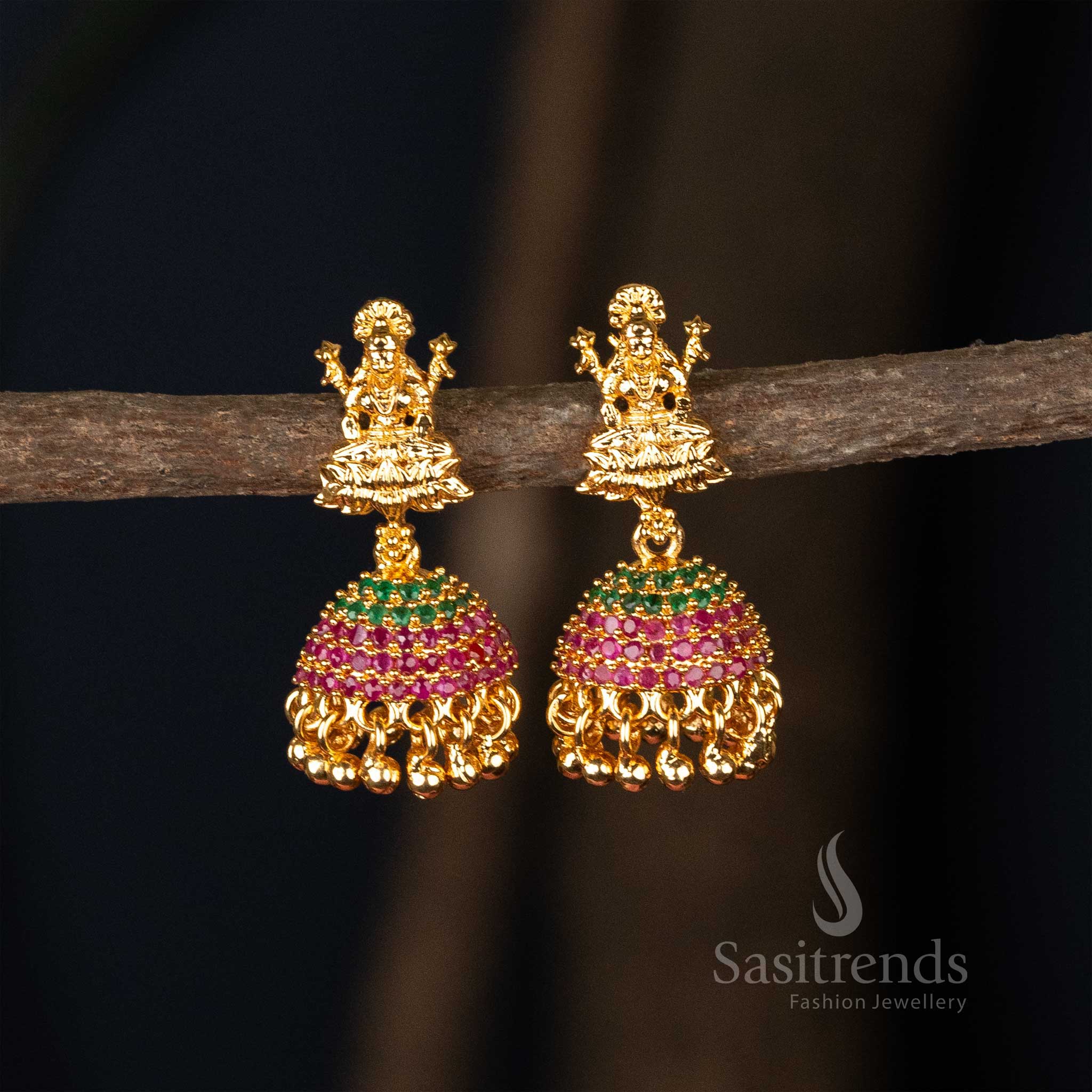 Majestic ruby-green colour micro gold plated flower designer jhumkas earrings enhanced with divine god motif, a perfect choice for traditional wedding wear - Sasitrends
