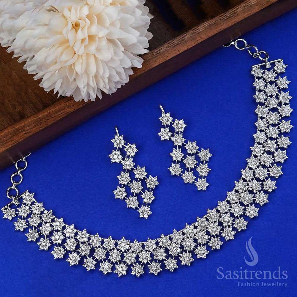 Regal everglow defines this rhodium silver American diamond wedding jewellery set, featuring a dazzling bridal necklace with exquisite stone arrangement and coordinated earrings – a divine choice for timeless celebrations – Sasitrends