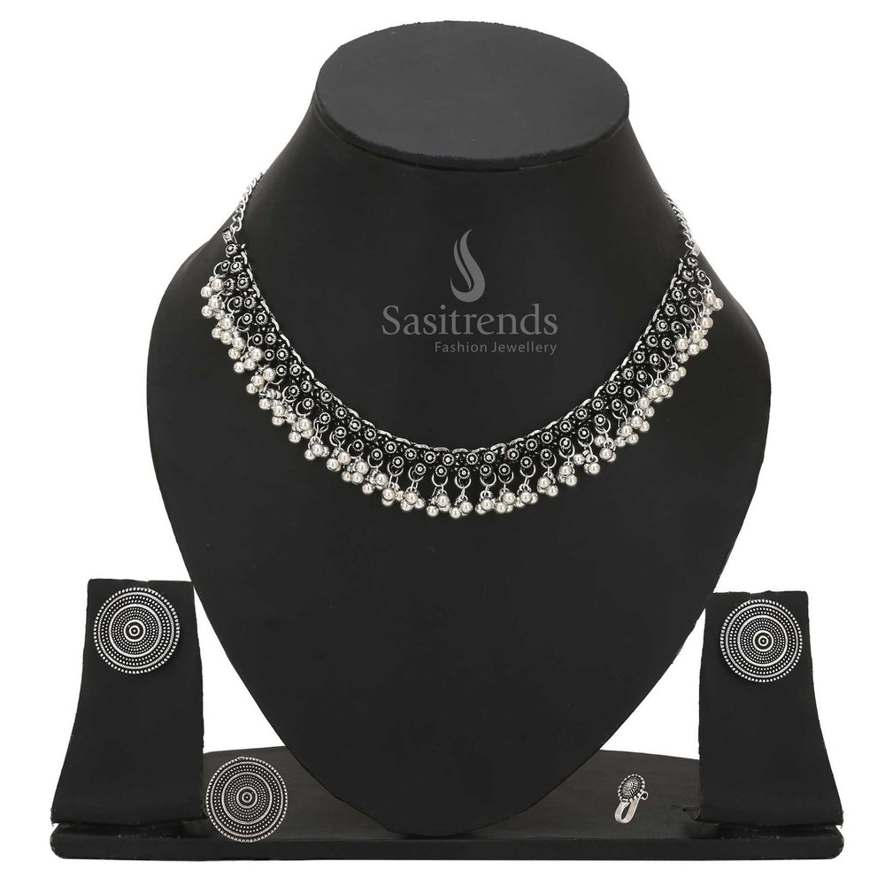Divine Mystique oxidised silver combo choker adorned with tribal design nosepin, statement earrings and ethno-ring – Sasitrends