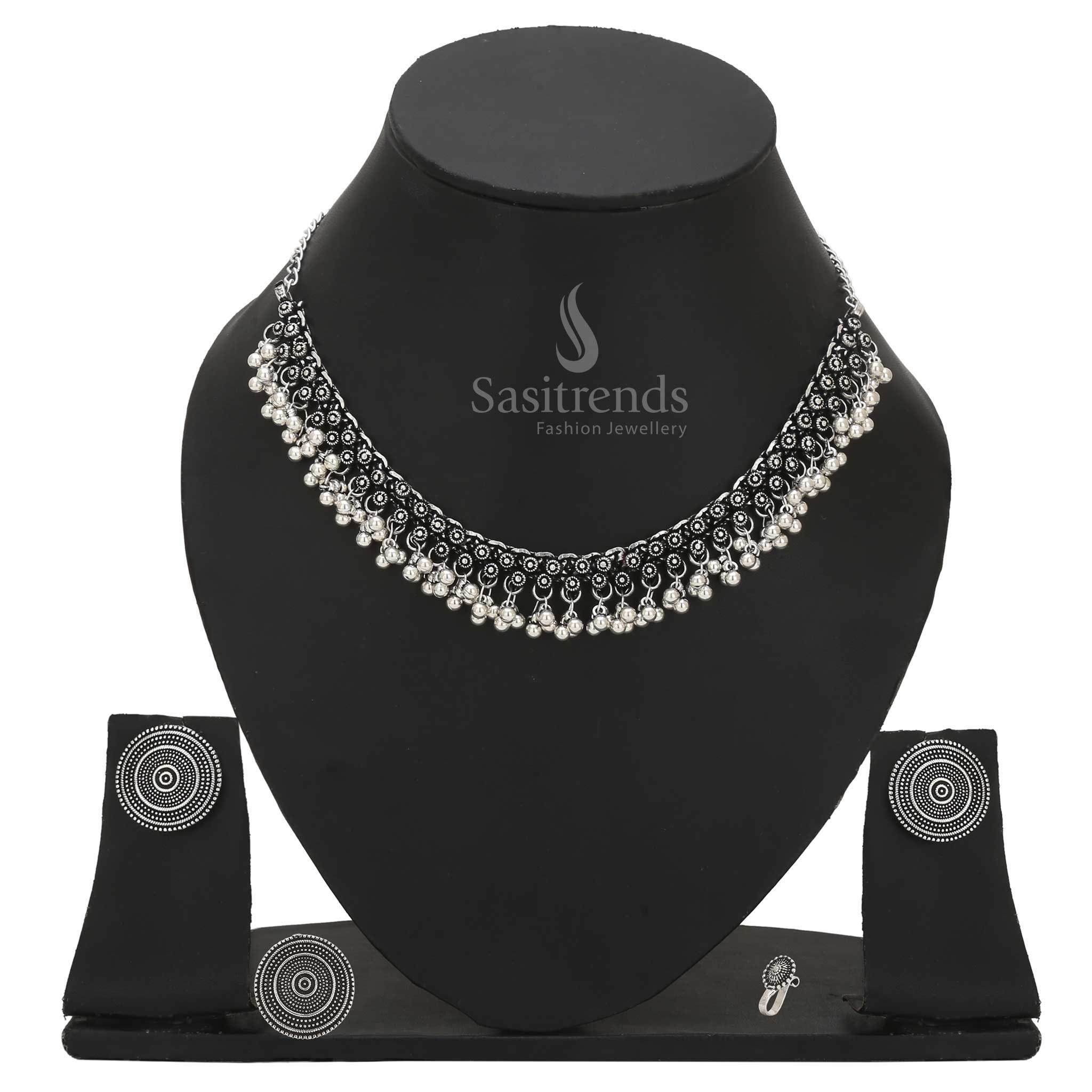 Divine Mystique oxidised silver combo choker adorned with tribal design nosepin, statement earrings and ethno-ring – Sasitrends