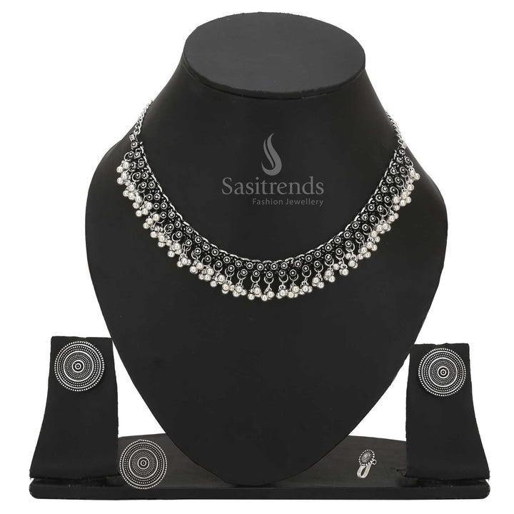 Divine Mystique oxidised silver combo choker adorned with tribal design nosepin, statement earrings and ethno-ring – Sasitrends