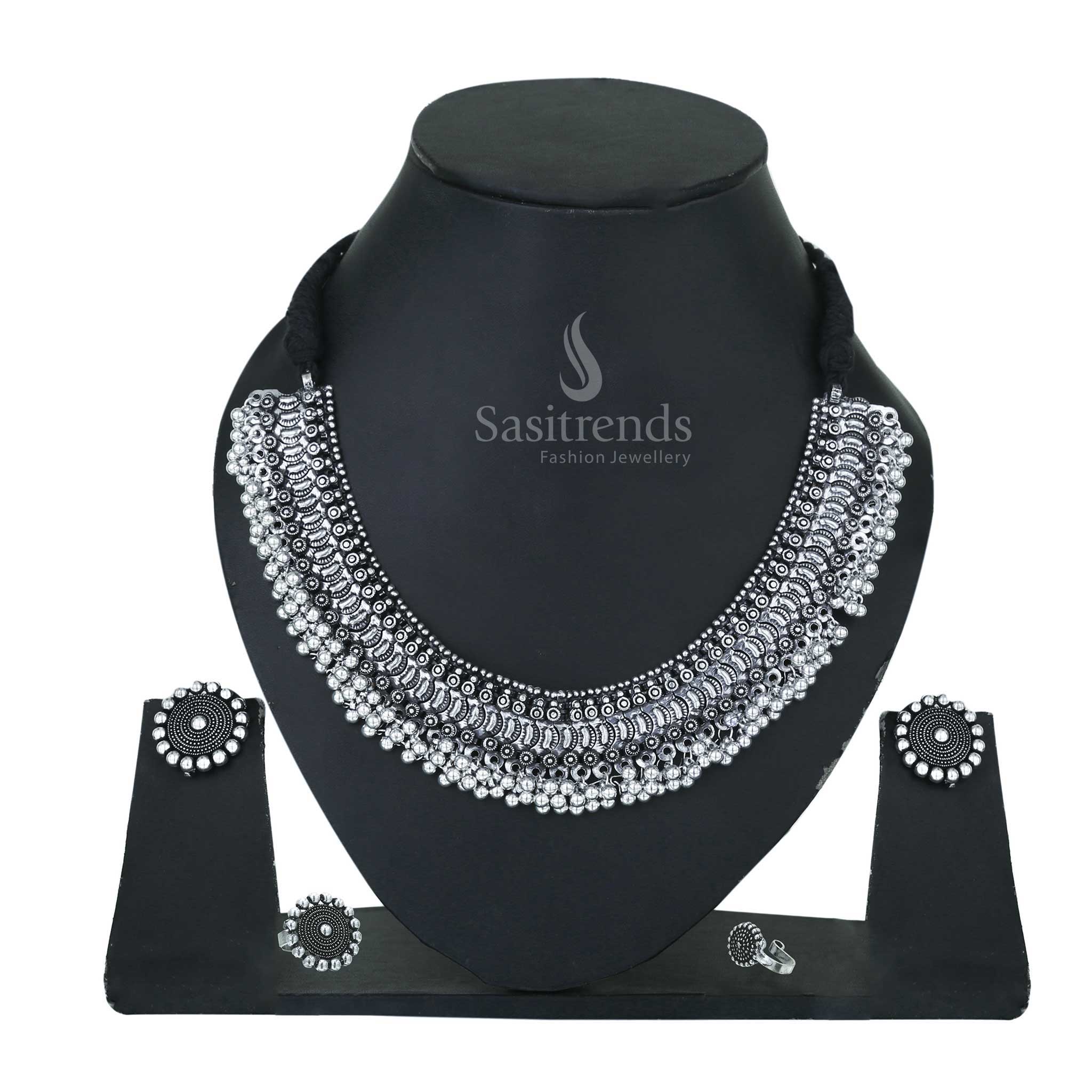 Sacred Bloom oxidised silver choker set detailed with kemp stone earrings, traditional ring and matching temple nosepin – Sasitrends
