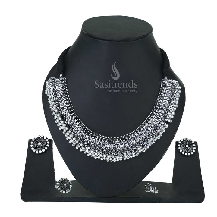 Sacred Bloom oxidised silver choker set detailed with kemp stone earrings, traditional ring and matching temple nosepin – Sasitrends