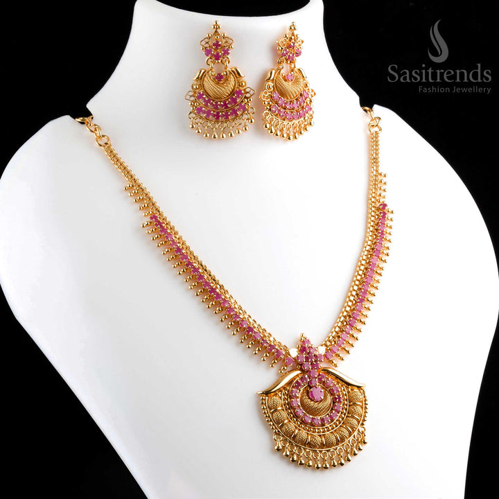 Stunning regal micro gold plated ruby AD tilak pendant necklace with earrings, featuring intricate patterns and dazzling AD stones - Sasitrends